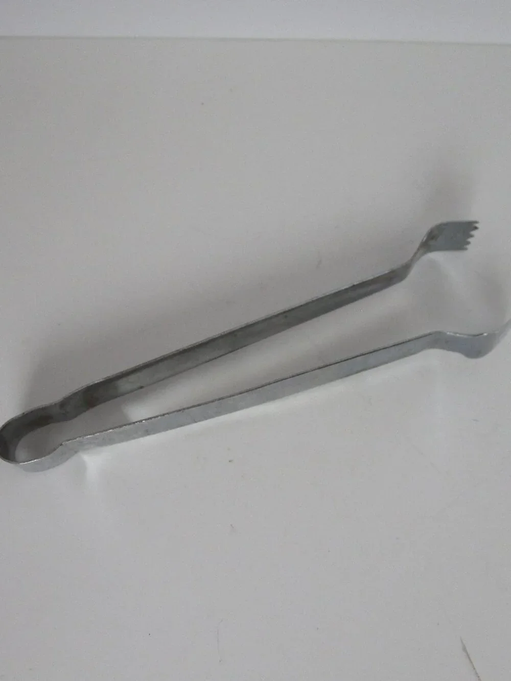 small stainless steel tongs